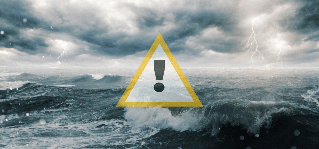 A stormy sea with large waves and lightning featuring a yellow warning triangle icon, representing maritime hazards and the need for situational awareness.