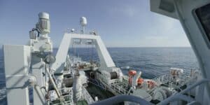 Commercial fishing vessel at sea equipped with satellite and monitoring equipment for AIS and VMS vessel data tracking